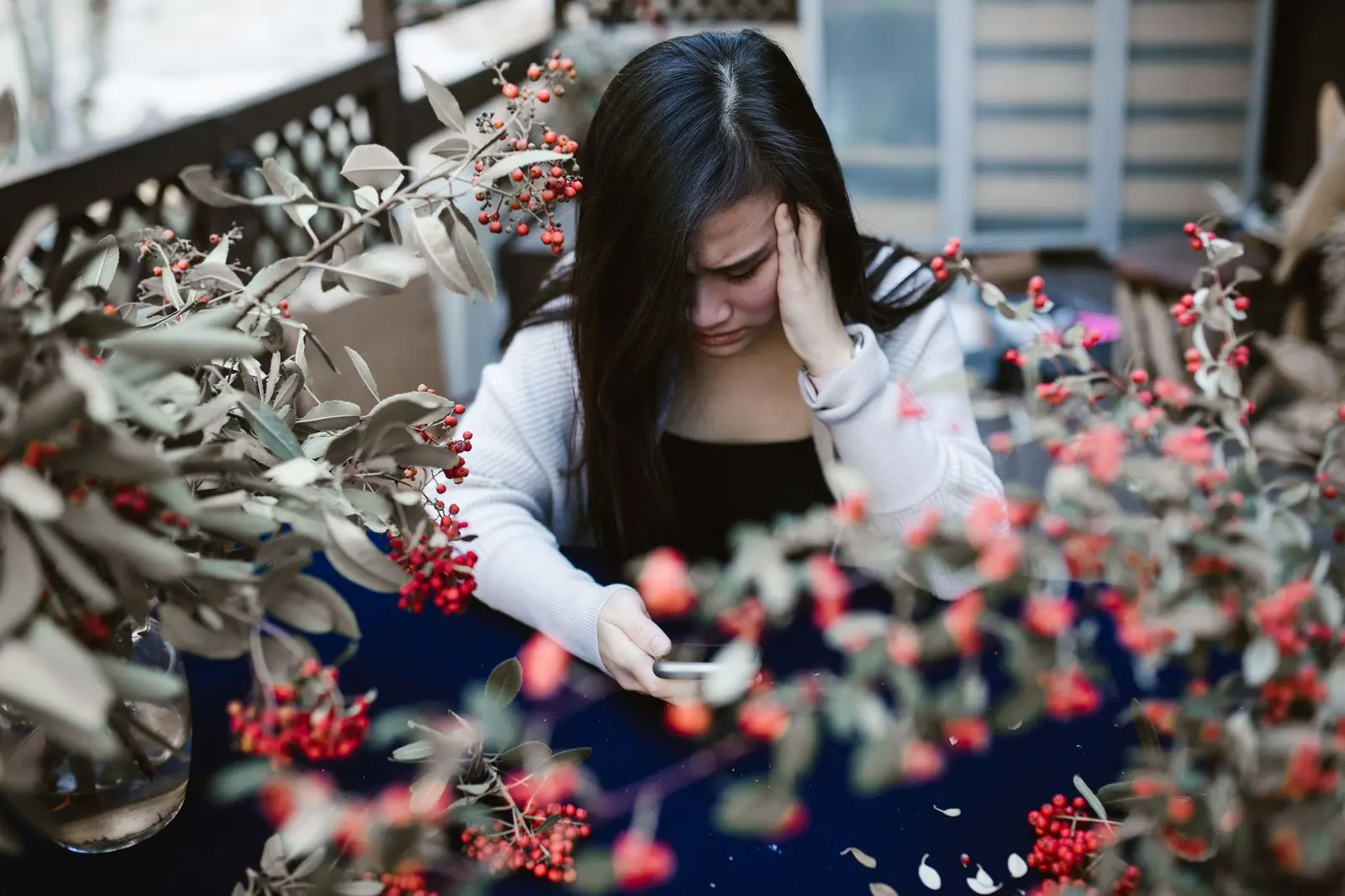 Clingy Girlfriend: Signs, Meaning, and What to Do: a worried person looking down at a phone
