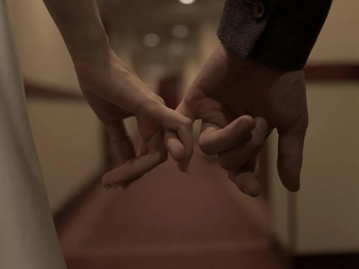 Two hands reaching toward each other as a small gesture of relationship repair