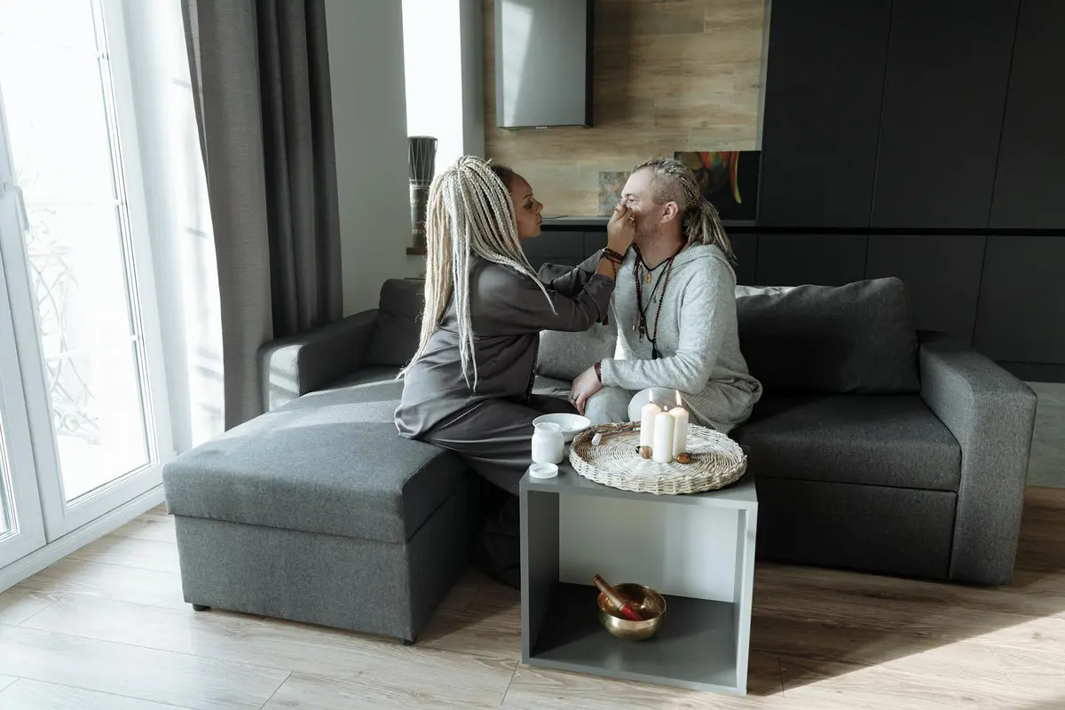 A couple sitting together with tea after choosing one small relationship repair action
