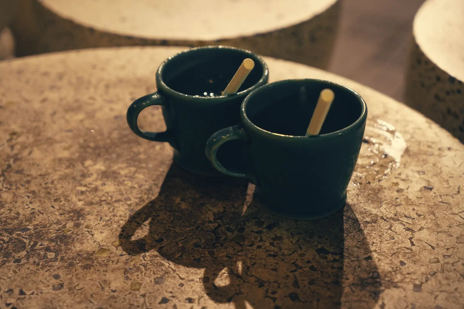 Love Hurts Quotes for Heartbreak, Healing, and Choosing Yourself: an empty cafe table with two cups and a lonely seat