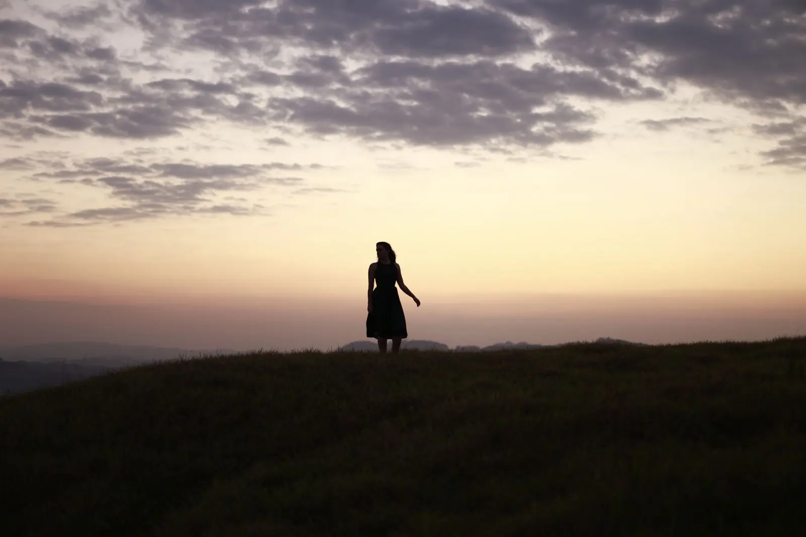 Love Hurts Quotes for Heartbreak, Healing, and Choosing Yourself: a person walking alone in warm light after choosing a boundary