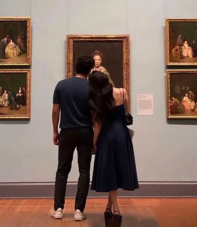 May-December relationship: two partners viewing art together in a quiet museum